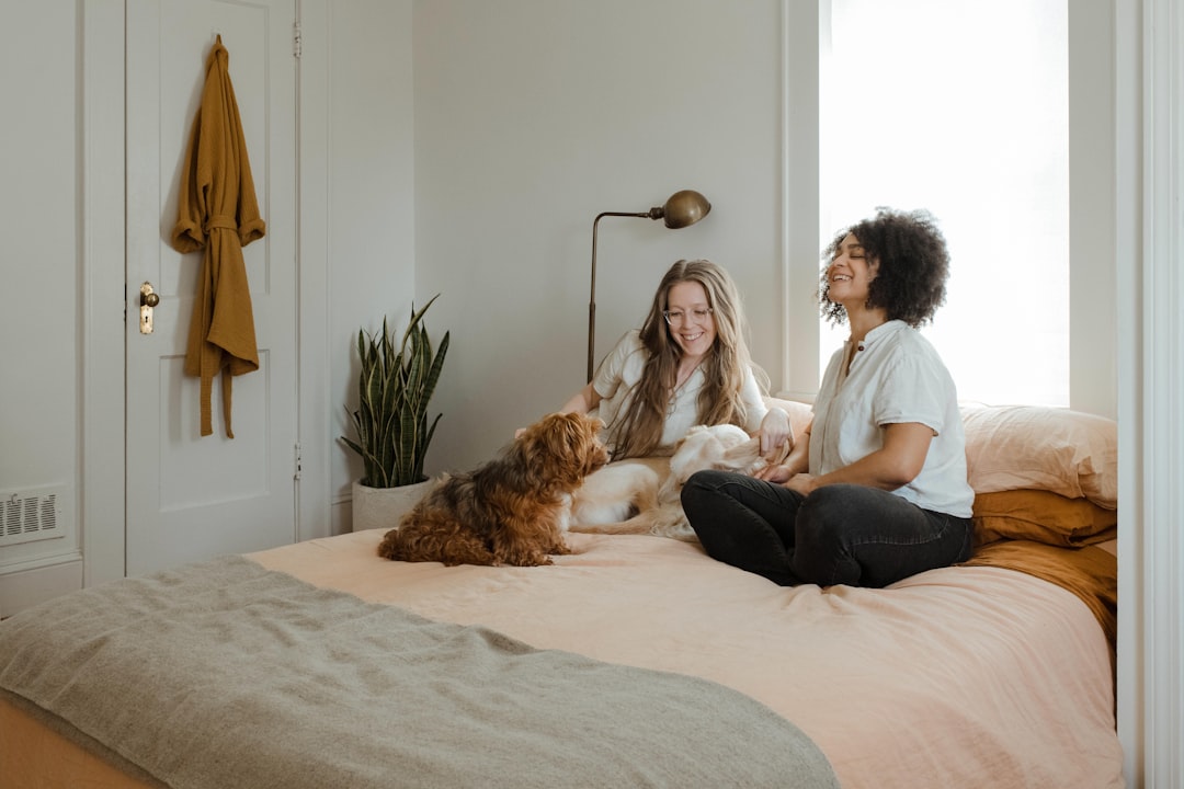A cozy living room with a dog and cat relaxing together, showcasing a harmonious pet-friendly environment.